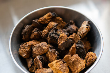 Powdered chaga mushroom powder. Medicinal chaga mushroom for brewing tea