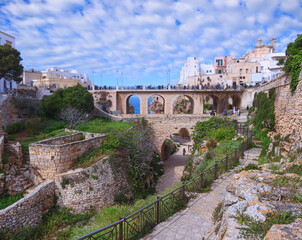 Polignano a Mare in Apulia, Italy: historic bridge over the famous Lama Monachile Beach. © vololibero