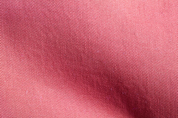Closeup of red textured cloth background