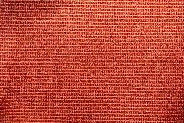 Closeup of red textured cloth background