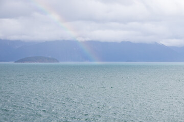 Storm clouds and rainbow over the ocean 