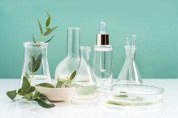 Alternative natural medicine and glassware, flasks and petri bowl. Alternative medicine herbs. Natural beauty skin care products. Concept research and development.