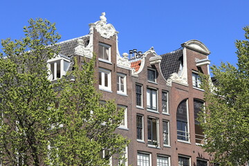 Amsterdam Oudezijds Voorburgwal Canal Historic Brick House Facades with Neck and Bell Gables, Netherlands