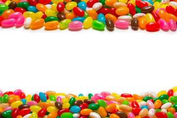 Colorful jelly beans isolated on white. Top view.