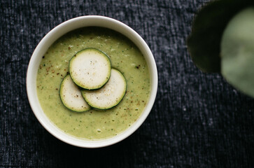 Green soup in bowl