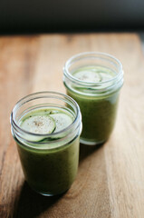 Green soup in glass cup