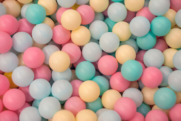 Bright multi-colored balls for the dry pool for childrens games. Toys, development for kids. Bright multi-color background.