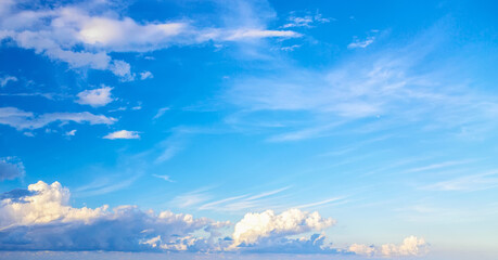 Blue sunset sky background with clouds. Can be used as a natural background.