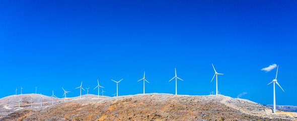 Ecology concept. Wind turbines in the mountains on the Kefalonia island, Greece