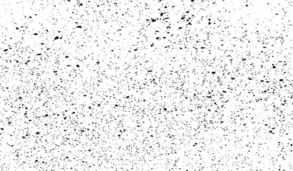 Small uneven spots and particles of debris. Abstract vector texture. Distressed uneven background. Grunge texture overlay with fine grains isolated on white background. Vector illustration. EPS10.