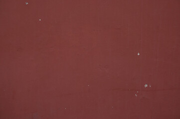 Old maroon concrete painted wall background