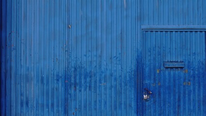 industrial worn blue metal door background