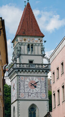 An ornate clock tower in keeps time for locals and tourists alike, in Passau, Germany
