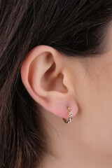 women's earrings with stones, jewelry, earrings at the ear of a beautiful girl, women's accessories, gold earrings, earrings with stones