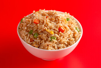 Bowl of Fried Rice on a Red Background