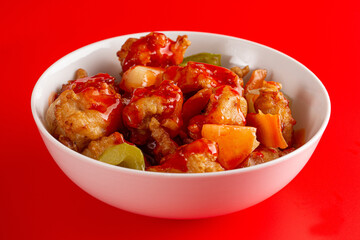 Bowl of Fried Chicken and Vegetables with Sweet and Sour Sauce