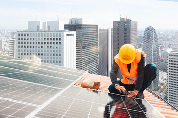 Workers assemble energy system with solar panel for electricity