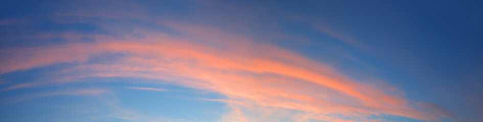Naklejka na ściany i meble Bright clouds in the evening sky