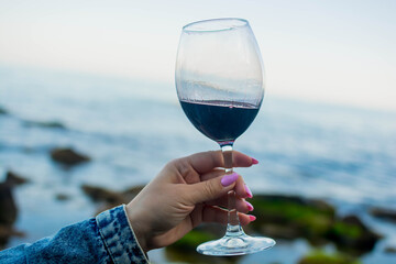Glass of wine by the sea
