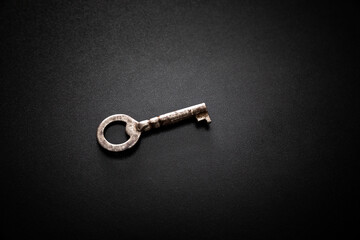 Old key on a dark background