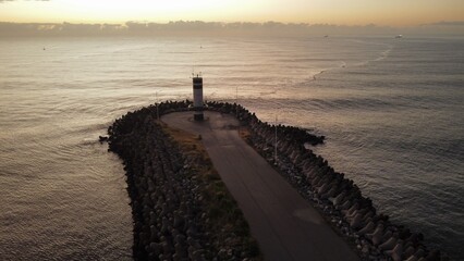 Lighthouse at river and sea