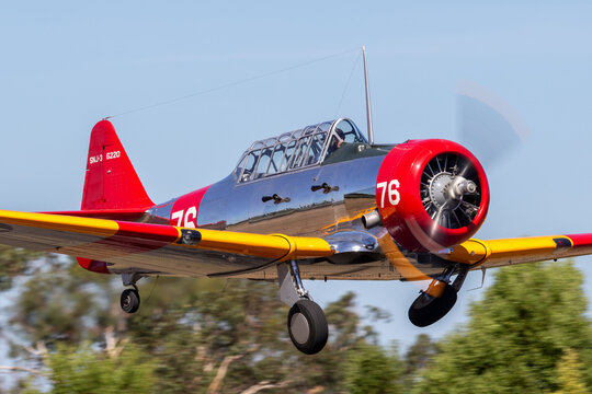 Tyabb, Australia - March 9, 2014: North American AT-6C Harvard VH-NZH single engine military training aircraft in US Navy markings from World War II.
