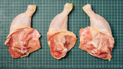 Raw chicken meat for cooking.Fresh chicken leg on a linear board.