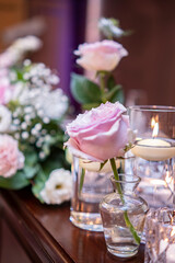 A small pink rose on the wedding Takasago