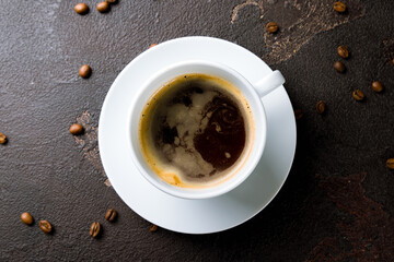 a Cup of coffee americano on the brown stone table top view