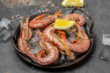 Close up Shrimps, prawns. Seafood Red Argentine shrimps with ice, Wild shrimps, ocean jumbo shrimps. Food recipe background. top view
