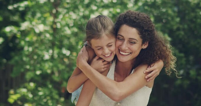 Sharing a love of the outdoors with her daughter. mother and her little daughter enjoying a day together outside. Cheerful mother and daughter affectionately embracing outside