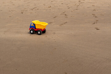 Fototapeta na wymiar a truck toy on the sand