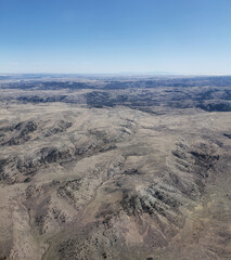 Fototapeta na wymiar Rugged Terrain of the American West seen from a plane