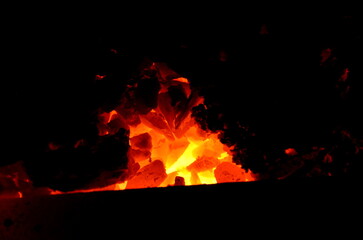 The dark background consists of anthracite burning coal.