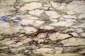 Granite is gray in color with a beautiful black pattern of leaves, stripes on the sides. Backgrounds design textures.