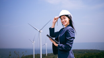 Wind turbine project manager,beautiful Asian Attractive working on wind power plants.Female...