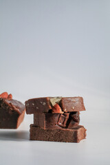 Banana bread with nut under sunlight on white background. Morning breakfast background. Close up view.