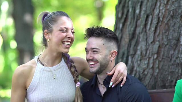 Couple laughing in the park and enjoying life