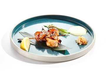 Japanese yakitori with skewers shrimp and teriyaki sauce. Grilled prawns  on bamboo stick in Japanese style. Bbq menu for asian restaurant. Prawn Yakitori on white background.