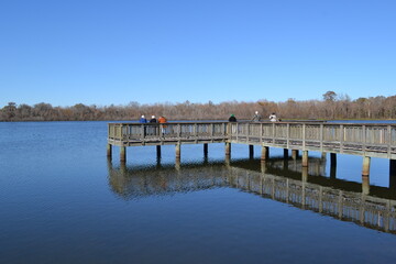 Obraz premium People on the fishing pier, Cullinan Park, Sugar Land