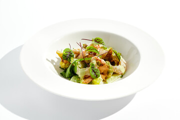 Green salad with broccoli, avocado, shrimps on white plate. Healthy dinner - Salad broccoli and prawns. Clean eating. Green bowl with vegetables and shrimps