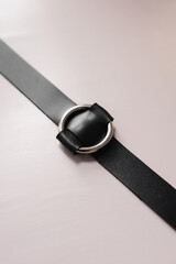 Black leather fetish collar with steel circle. Fetish stuff for bdsm role playing games. Close-up,...