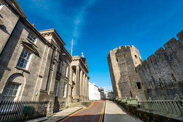 Fototapeta na wymiar Caernarfon Castle,low angle view of exterior walls,Wales,United Kingdom.