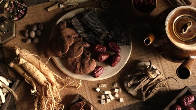Close view of chinese traditional herb ginseng mushroom in wooden table