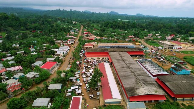 Aerial view over the Bobo Forro market, in Me-Zochi, Sao Tome - reverse, drone shot