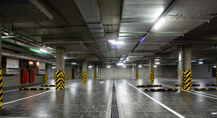 View of the underground parking, a lot of free places, in a shopping complex