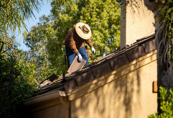 Roofer working on a residential roof
