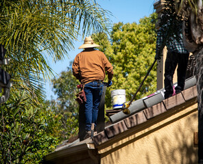 Roofer working on a residential roof