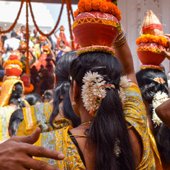 Women with Kalash on head during Jagannath Temple Mangal Kalash Yatra, Indian Hindu devotees carry...