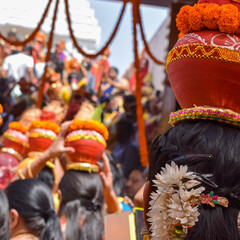 Women with Kalash on head during Jagannath Temple Mangal Kalash Yatra, Indian Hindu devotees carry...